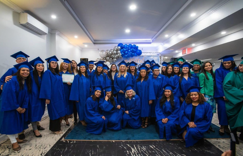 A group in graduation gowns gathered for a photo
