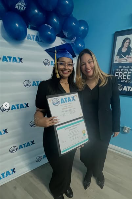 Two people posing with ATAX graduation certificates